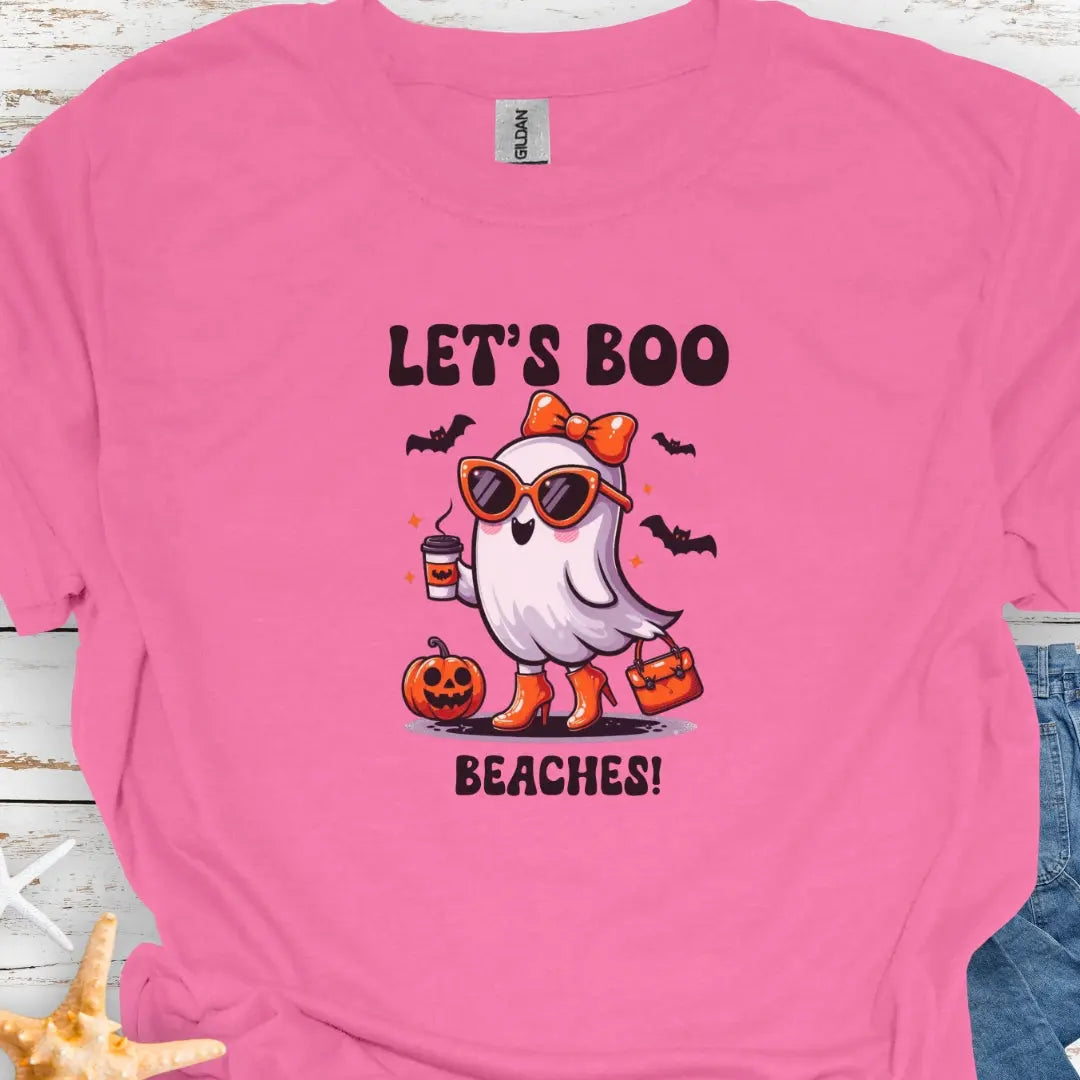 Azalea t-shirt with a girl ghost wearing sunglasses, high heels and an orange bow in hair holding a purse and coffee with bats flying around with text Let's Boo Beaches'