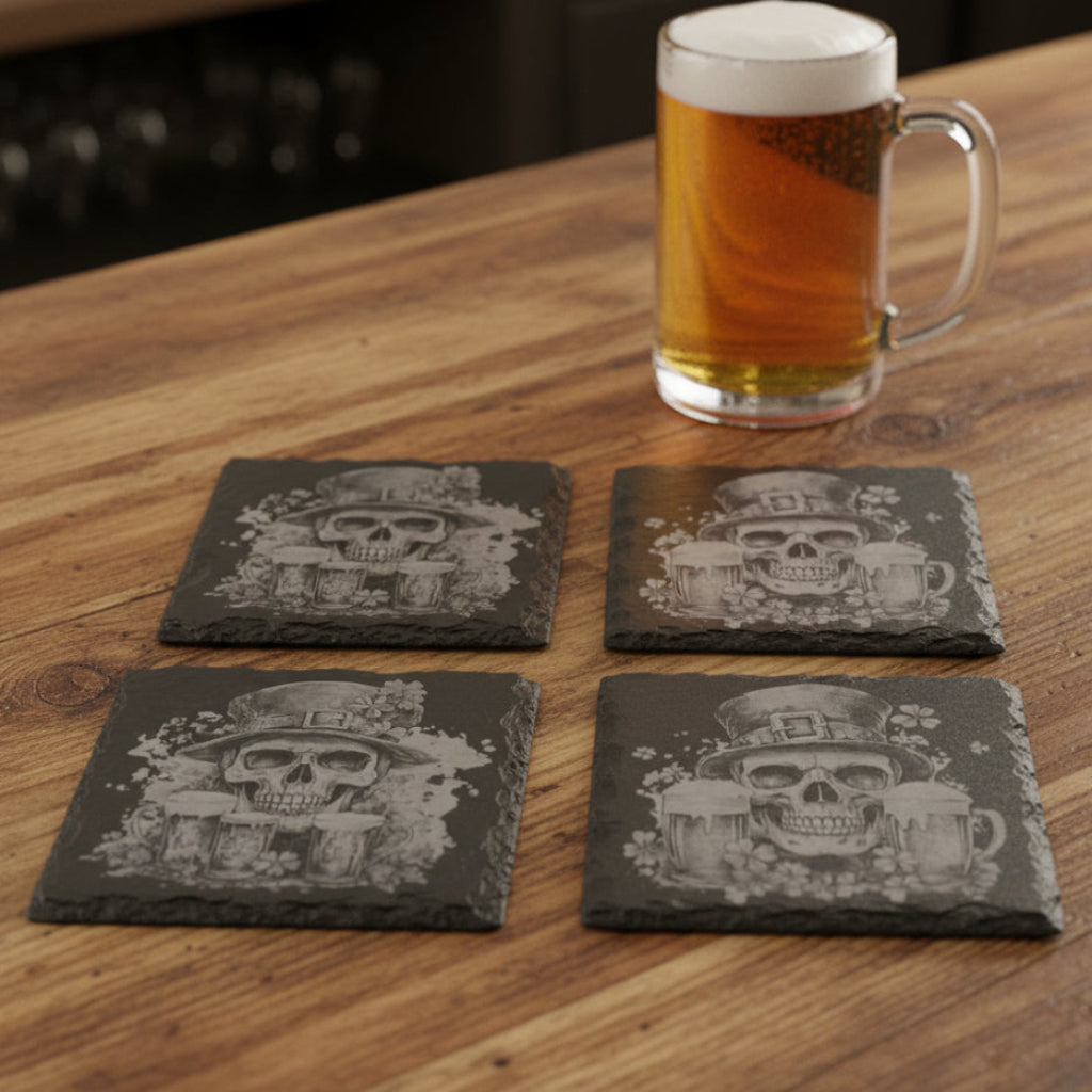 Set of 4 Black 4" slate coasters with Irish skulls with beer and shamrock designs.
