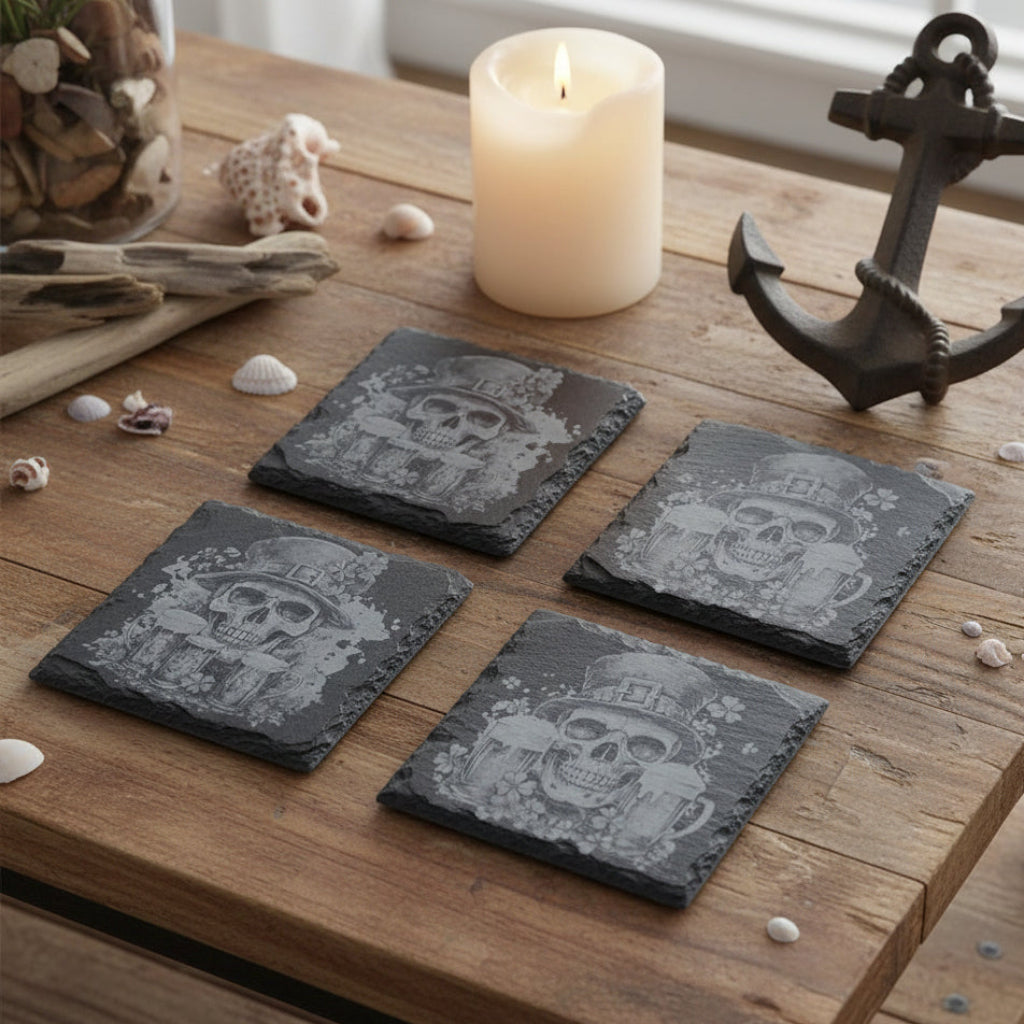 Four black slate coasters with skull and beer design