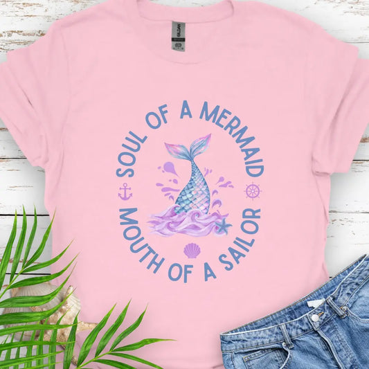 Light Pink T-shirt with fish tail coming out of the water with text Soul of a Mermaid Mouth of a Sailor.