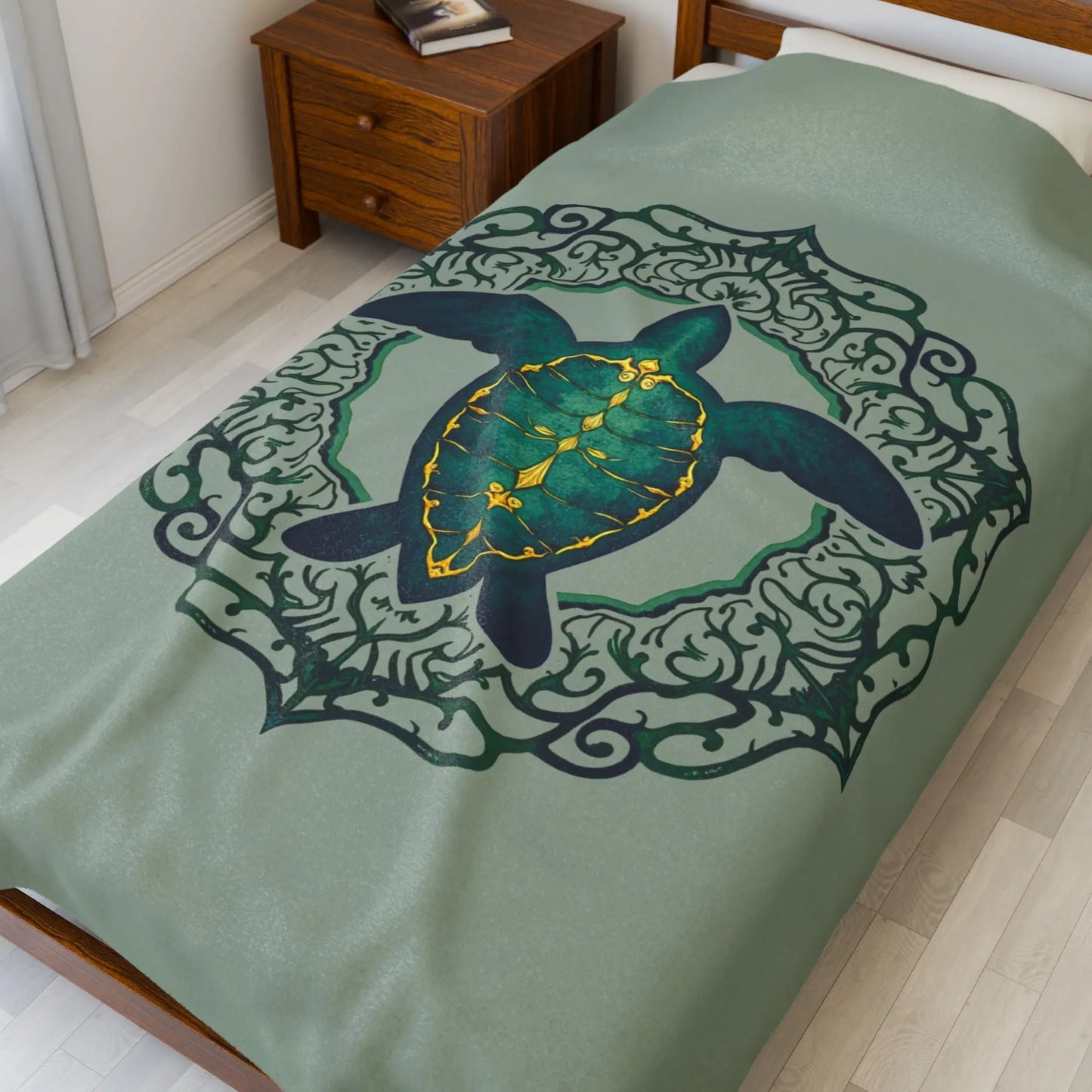 Our plush 60x80" velveteen blanket in sage with a sea turtle and a fancy mandala frame in emerald green.