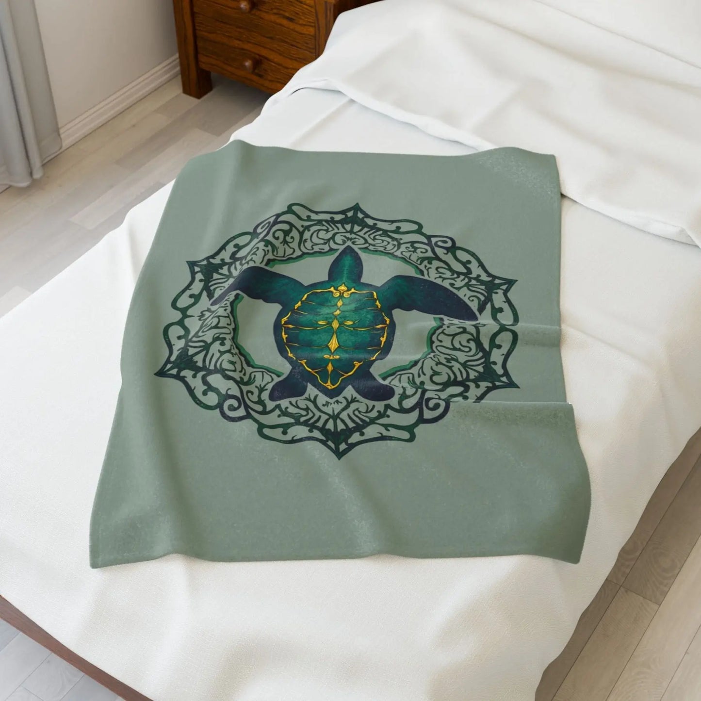 Our plush velveteen 40x60" blanket in sage with a sea turtle and a fancy mandala frame in emerald green.
