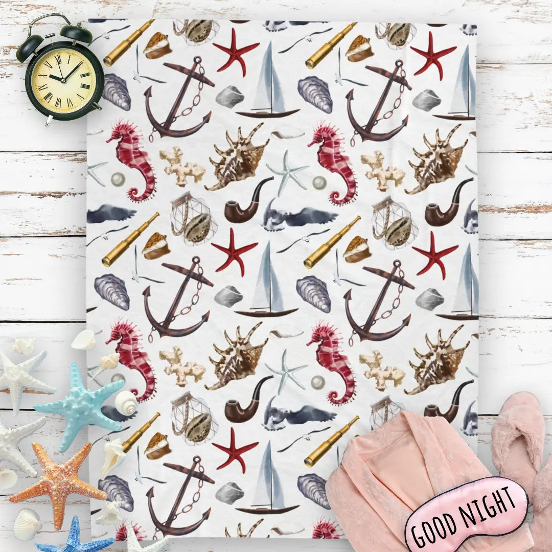 White blanket with nautical graphics