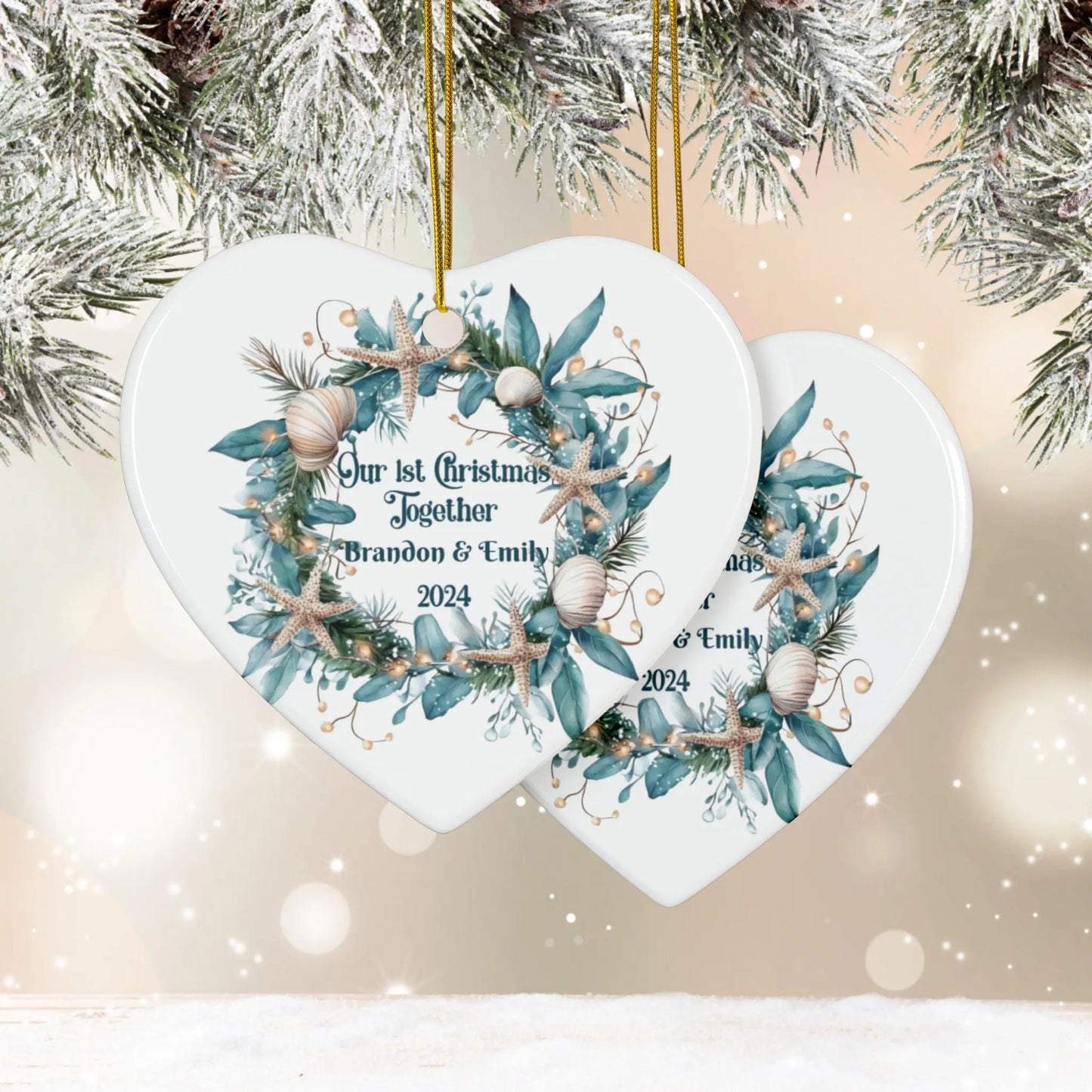 Front and back white heart ornament featuring a beach-themed wreath with seashells and starfish, displaying "Our 1st Christmas Together." Personalized with names and year, this coastal holiday keepsake is perfect for celebrating a special first Christmas.