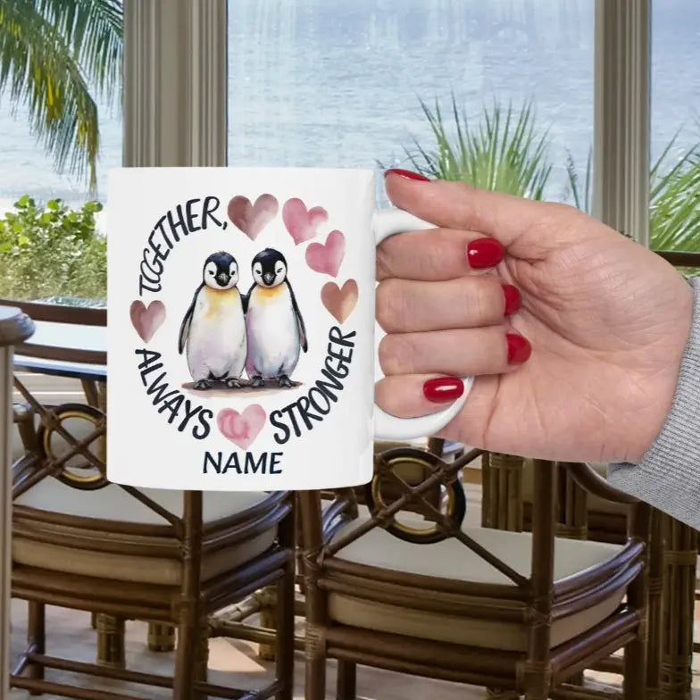 White 11 oz ceramic mug featuring two adorable penguins with hearts and the phrase 'Always Stronger Together.' A perfect gift for couples, friends, or family, this durable and microwave-safe mug is ideal for coffee, tea, or hot cocoa."