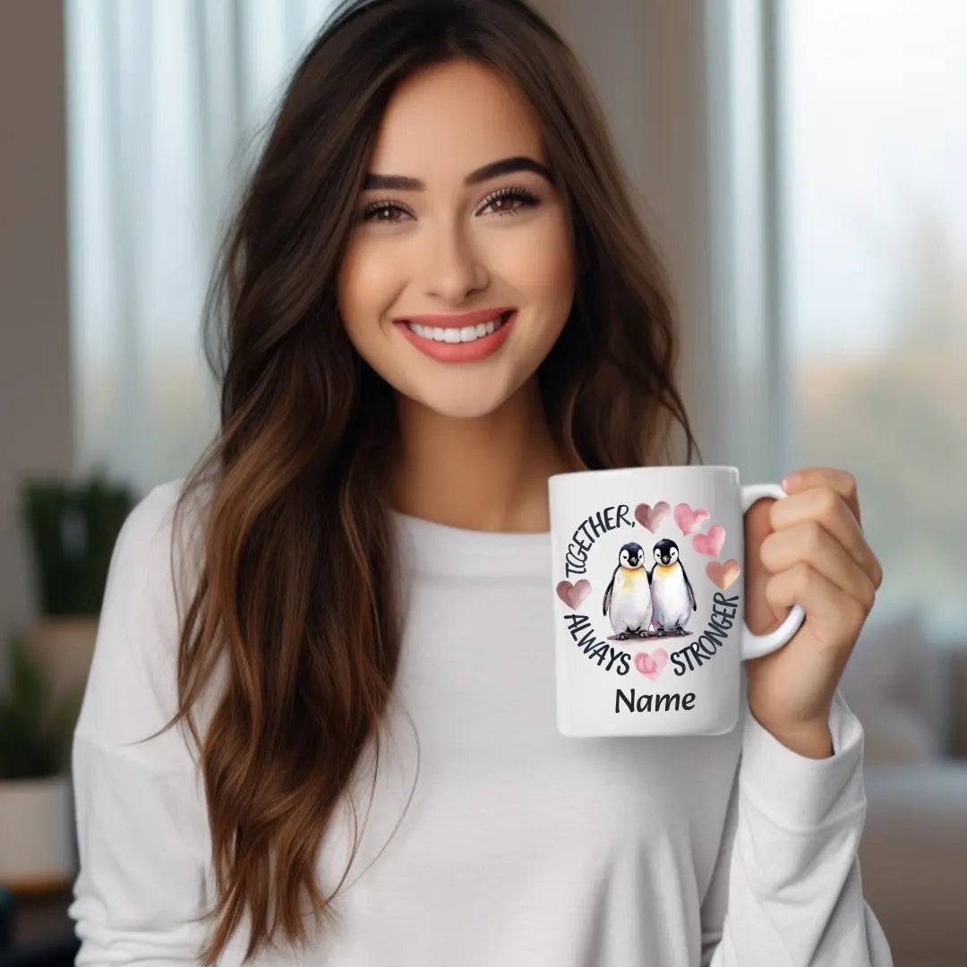White 15 oz ceramic mug featuring two adorable penguins with hearts and the phrase 'Always Stronger Together.' A perfect gift for couples, friends, or family, this durable and microwave-safe mug is ideal for coffee, tea, or hot cocoa."