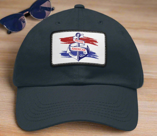 Navy Curved-bill hat with leather patch featuring an anchor design and the words “Proud American,” perfect for patriotic celebrations and everyday wear.