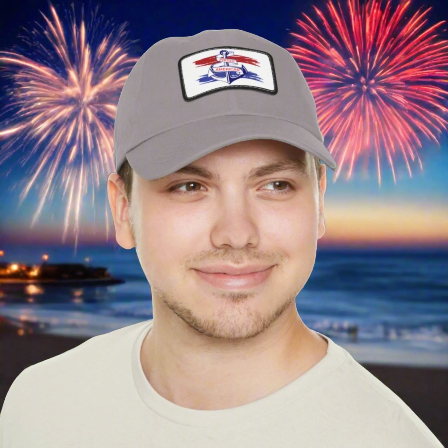 Gray hat with white patch red and blue behind a blue anchor with text Proud American