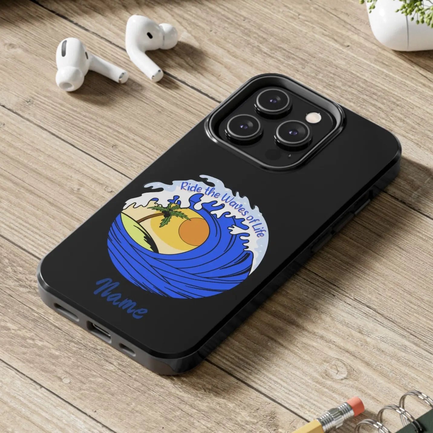 Black iPhone 14 Pro Case with wave with sun and palm tree in the middle that says Ride the Waves of Life.