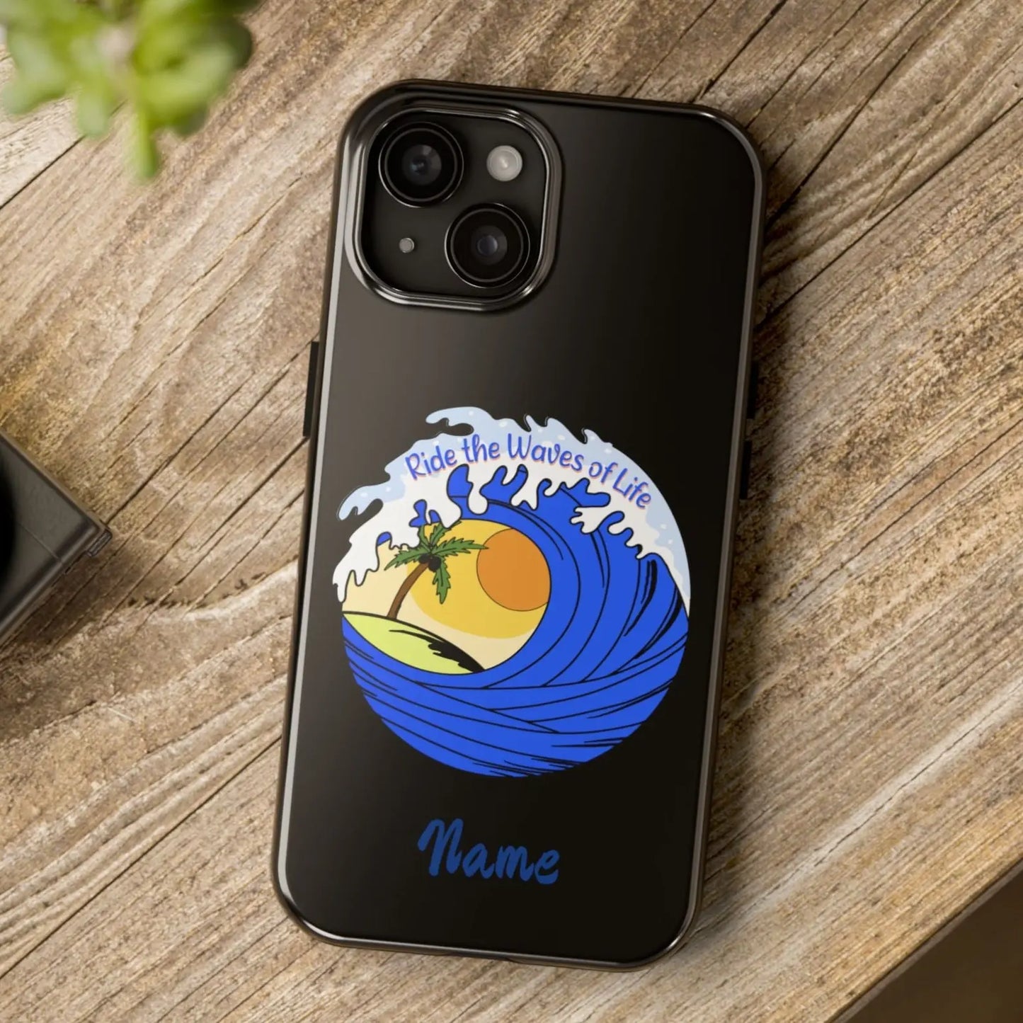 Black iPhone 15 Case with wave with sun and palm tree in the middle that says Ride the Waves of Life.