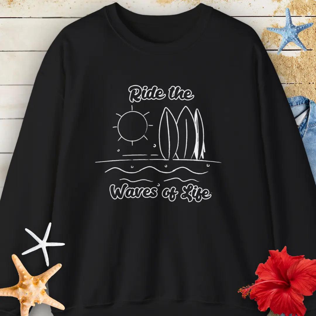 Our Ride the Waves of Life Sweatshirt in Black with Surfboards and the sun line art with the phrase ide the Waves of Life. Perfect for any surfing enthusiast.