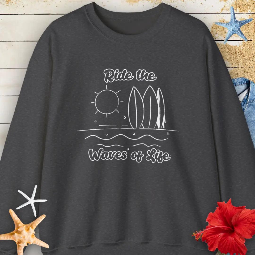 Our Ride the Waves of Life Sweatshirt in Dark Heather with Surfboards and the sun line art with the phrase ide the Waves of Life. Perfect for any surfing enthusiast.