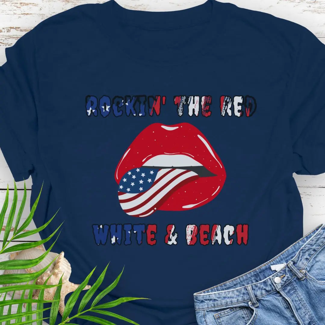 Navy T-shirt with rolling stones lips with American flag tongue hanging out that says Rockin' the Red, White & Beach with text that is filled with the flag.