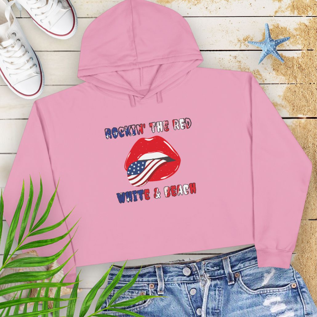 Mauve Rockin' the Beach Crop Hoodie - Patriotic Fashion for Summer Celebrations Hoodie featuring rolling stone lips with an American flag tongue and text that says Rockin' the Red White and Blue that has a gradient of the flag inside.
