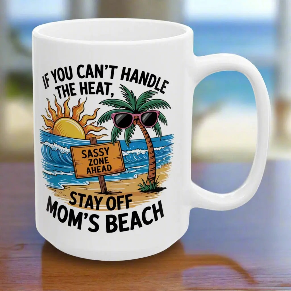 A white 15 oz mug with a beach scene and a beach sign that says Sassy Zone Ahead with the text If You Can't Handle the Heat Stay Off Mom's Beach.
