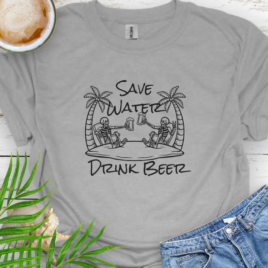 Sport Gray T-shirt featuring two skeletons on a beach clinking beer bottles with the phrase "Save Water Drink Beer" in a playful coastal setting.