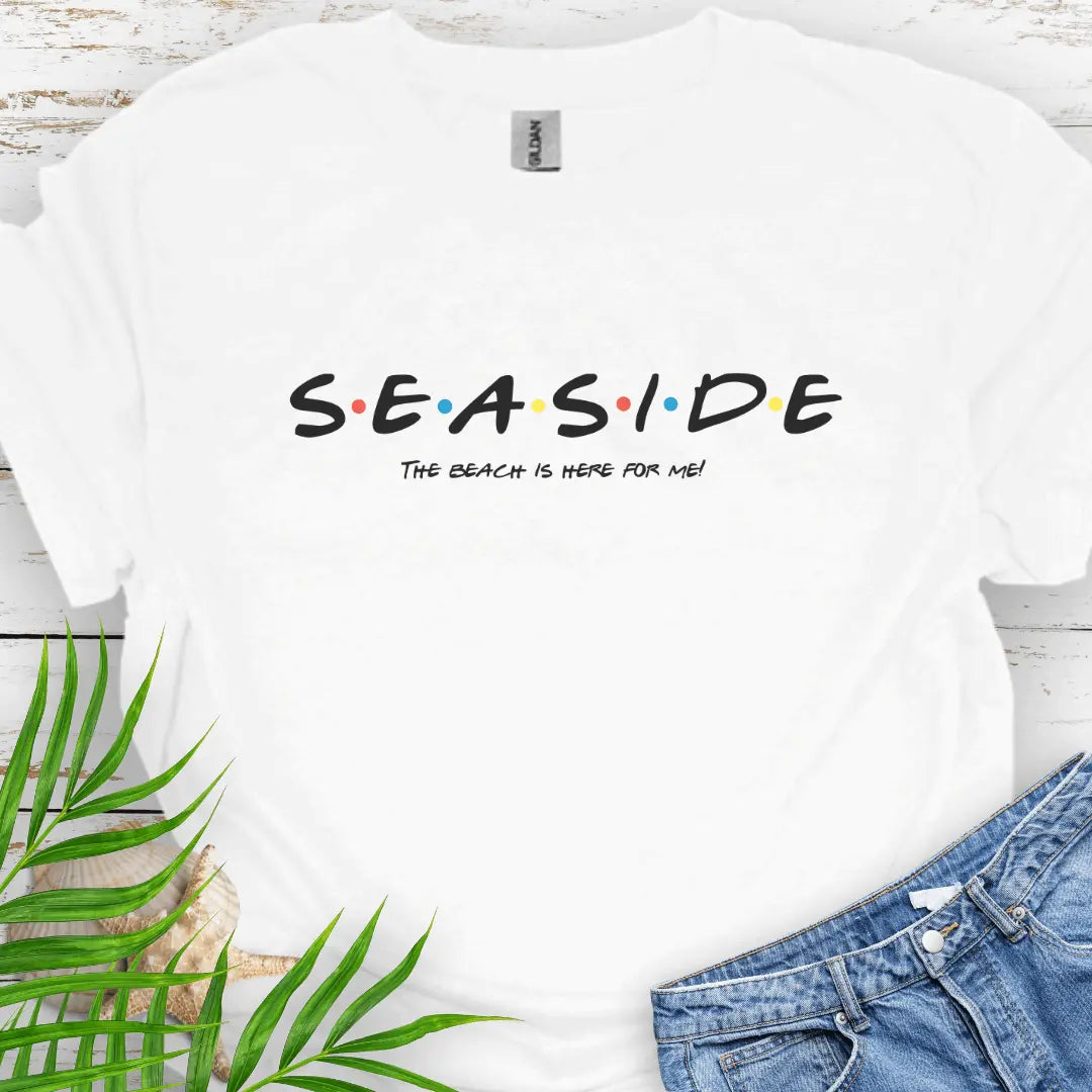 White T-shirt with a Friend's style font that says Seaside and underneath says The Beach is Here for Me.