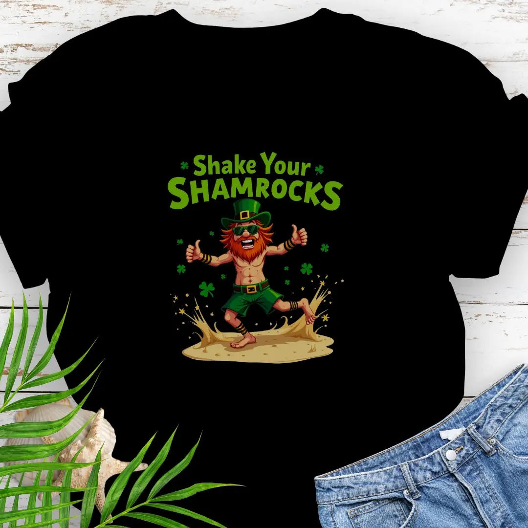 Shop our fun and festive dancing leprechaun in beach attire with shamrock confetti with the text 'Shake Your Shamrocks' Black T-shirt! Perfect for St. Patrick's Day celebrations or anyone who loves a touch of whimsy in their wardrobe.