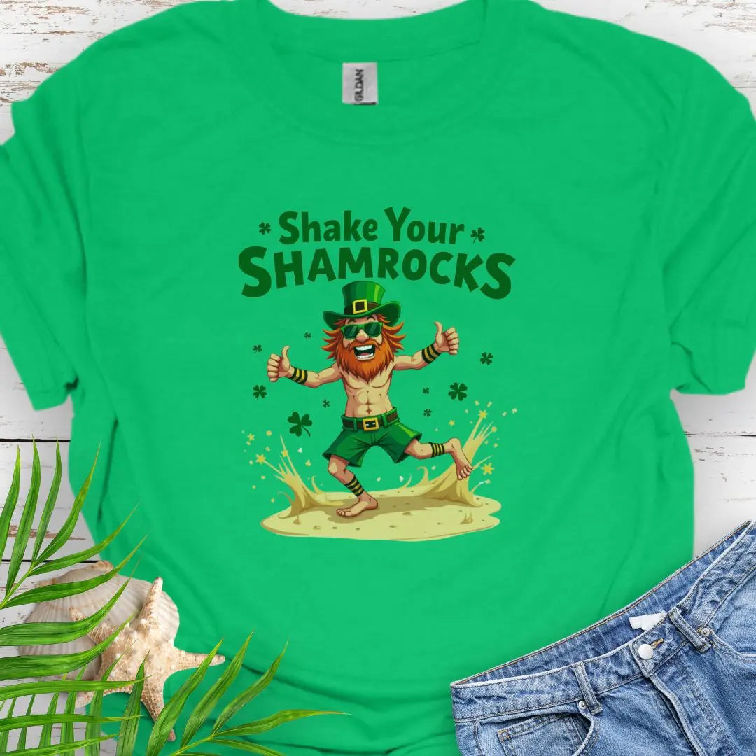 Shop our fun and festive dancing leprechaun in beach attire with shamrock confetti with the text 'Shake Your Shamrocks' Irish Green T-shirt! Perfect for St. Patrick's Day celebrations or anyone who loves a touch of whimsy in their wardrobe.