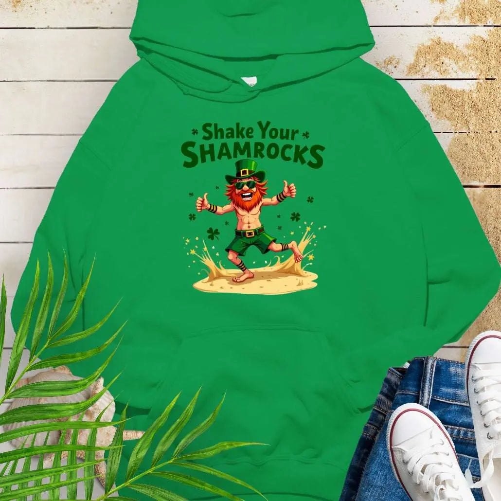 Shop our fun and cozy dancing leprechaun in beach attire with shamrock confetti with the text 'Shake Your Shamrocks' Irish Green Hoodie! Perfect for St. Patrick's Day celebrations or anyone who loves a touch of whimsy in their wardrobe.