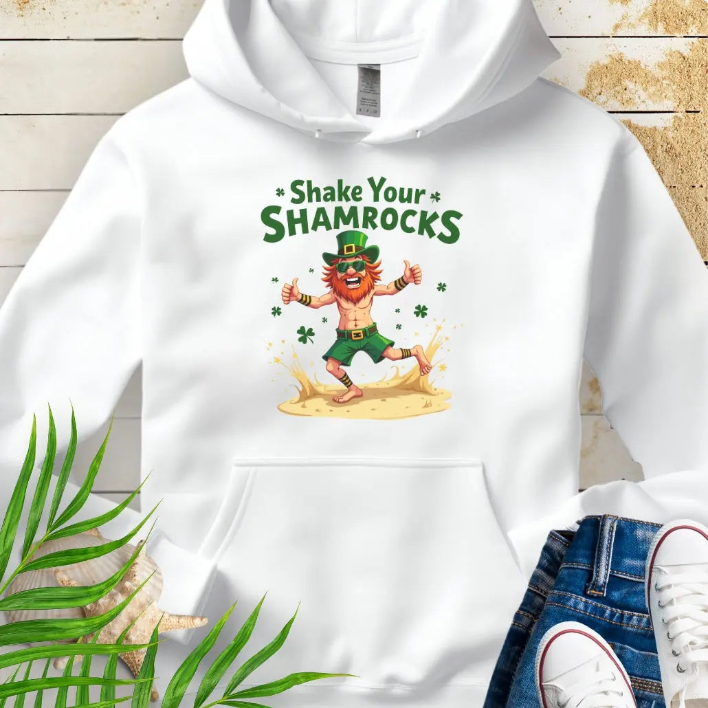 Shop our fun and cozy dancing leprechaun in beach attire with shamrock confetti with the text 'Shake Your Shamrocks' White Hoodie! Perfect for St. Patrick's Day celebrations or anyone who loves a touch of whimsy in their wardrobe.