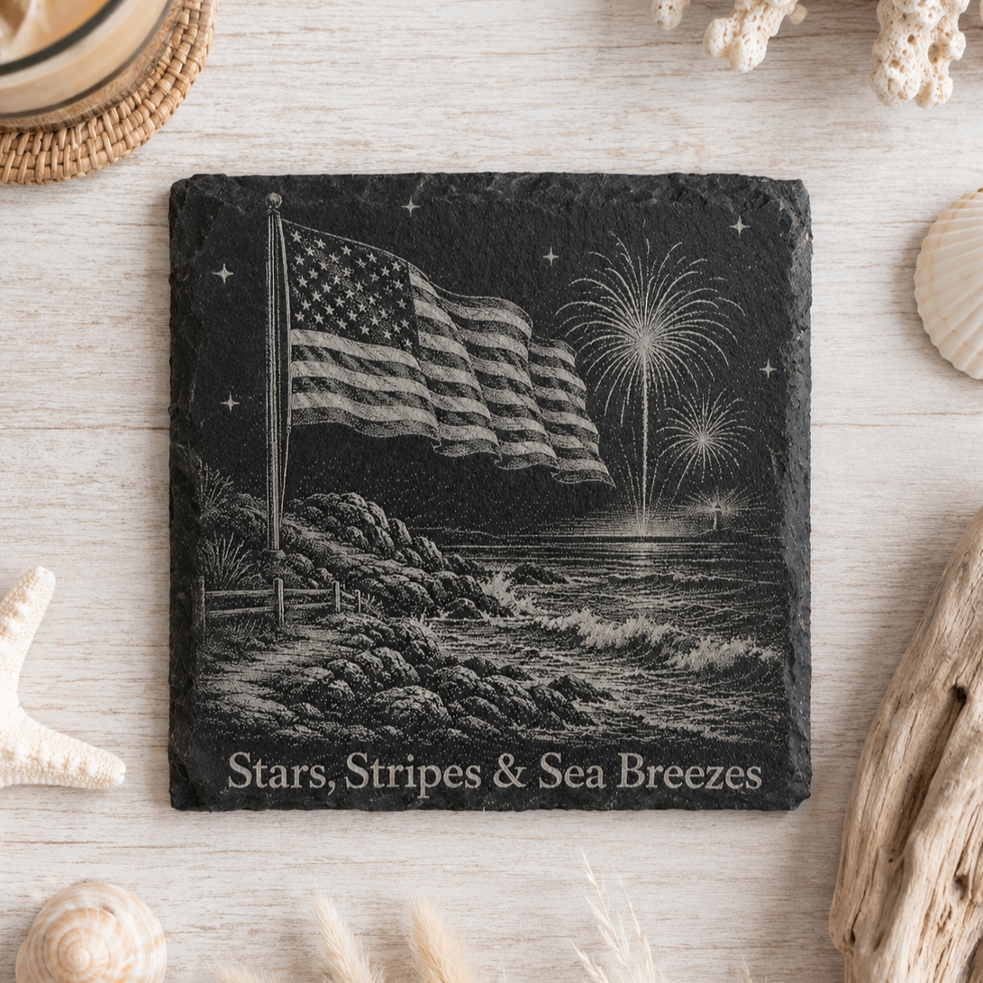 Laser engraved natural slate coaster featuring a patriotic bald eagle, fireworks, lighthouse, and "Land of the Free" with protective padded feet.