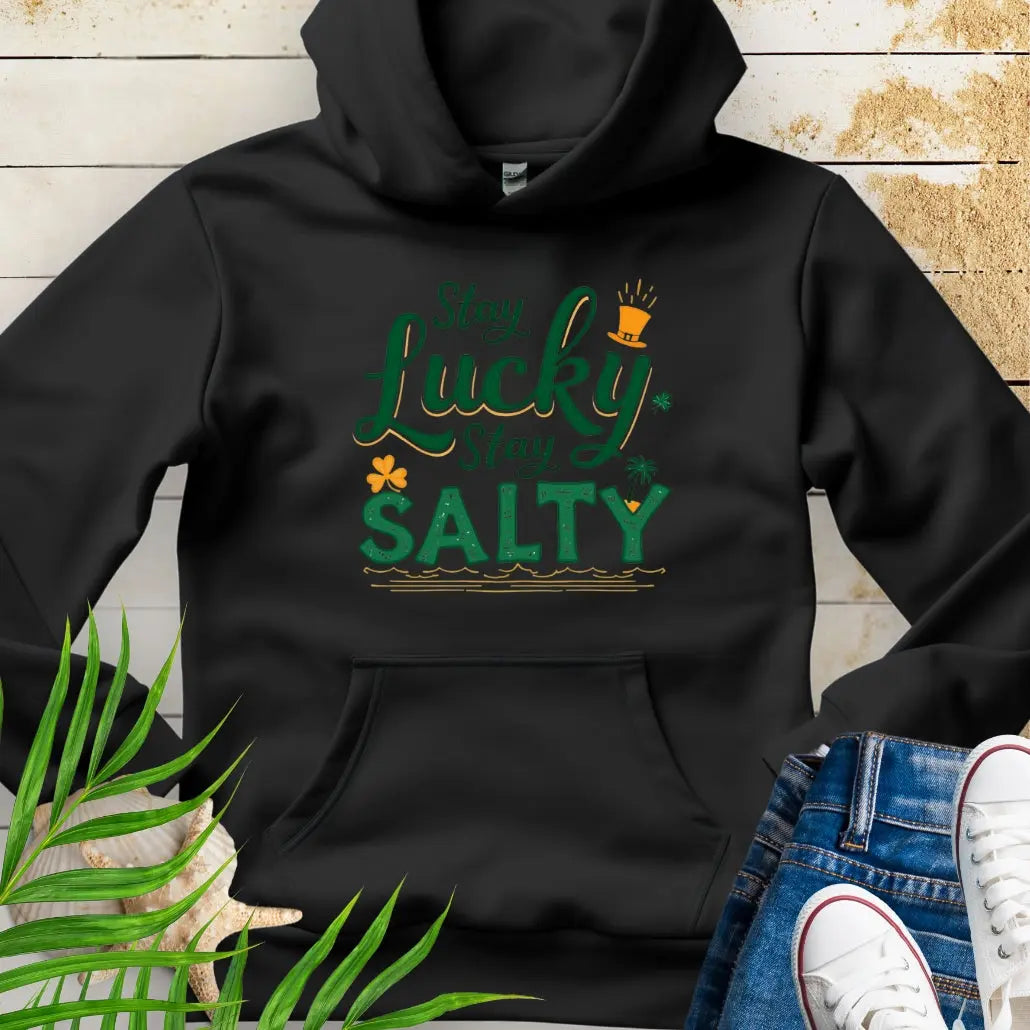 Our Stay Lucky Stay Salty Black Hoodie with St. Patrick's Day and beach embellishments including shamrock, leprechaun hat, palm tree and ocean waves.