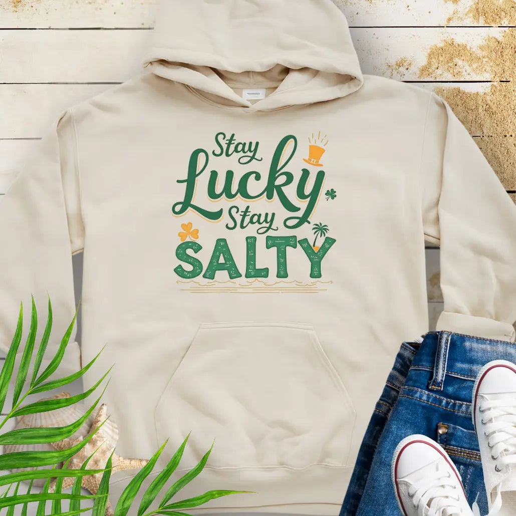 Our Stay Lucky Stay Salty Natural Hoodie with St. Patrick's Day and beach embellishments including shamrock, leprechaun hat, palm tree and ocean waves.