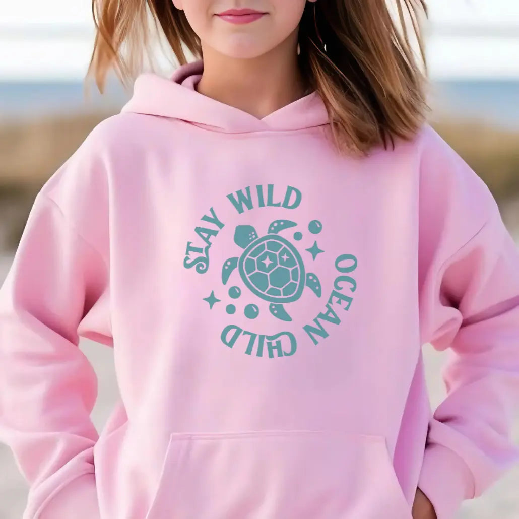 PInk hoodie with sea turtle with text Stay Wild Ocean Child.