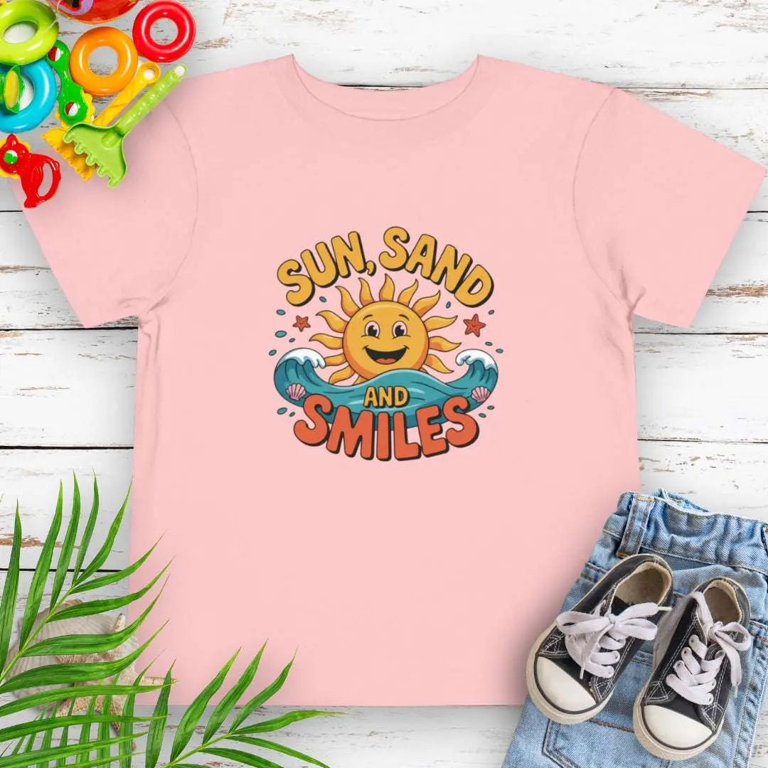 Pink Toddler T-shirt with a smiling sun and waves that says Sun, Sand and Smiles.