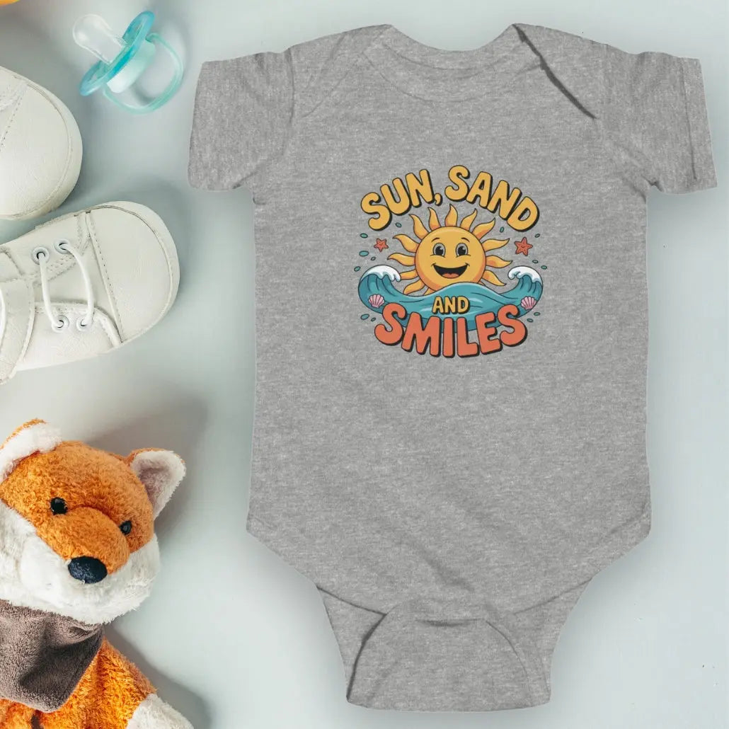 Gray One-piece short-sleeved infant bodysuit with a smiley sun and waves that says Sun, Sand and Smiles.