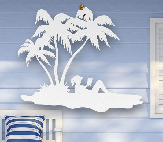 White Metal wall art of a woman reading under palm trees on the beach, sunbathing in a tropical scene, crafted from steel and available in multiple sizes and colors.