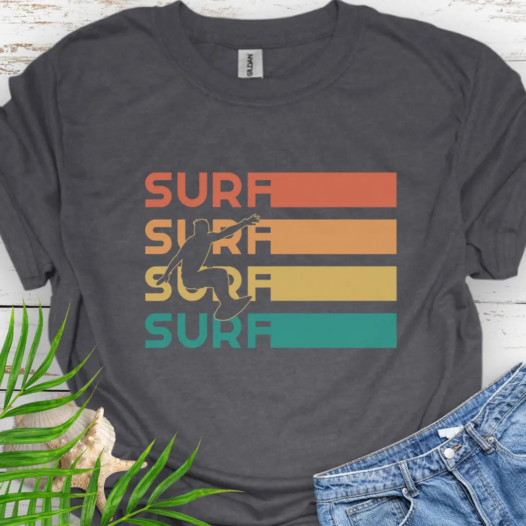 Dark Heather T-shirt with silhouette of surfer over four rows that says surf in rainbow colors and extend out in rectangle. Perfect for surfing enthusiasts.