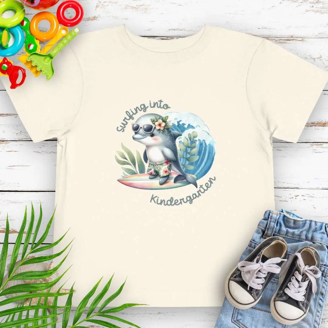 Surfing Into Kindergarten Natural Toddler's T-shirt with a fun dolphin surfing.