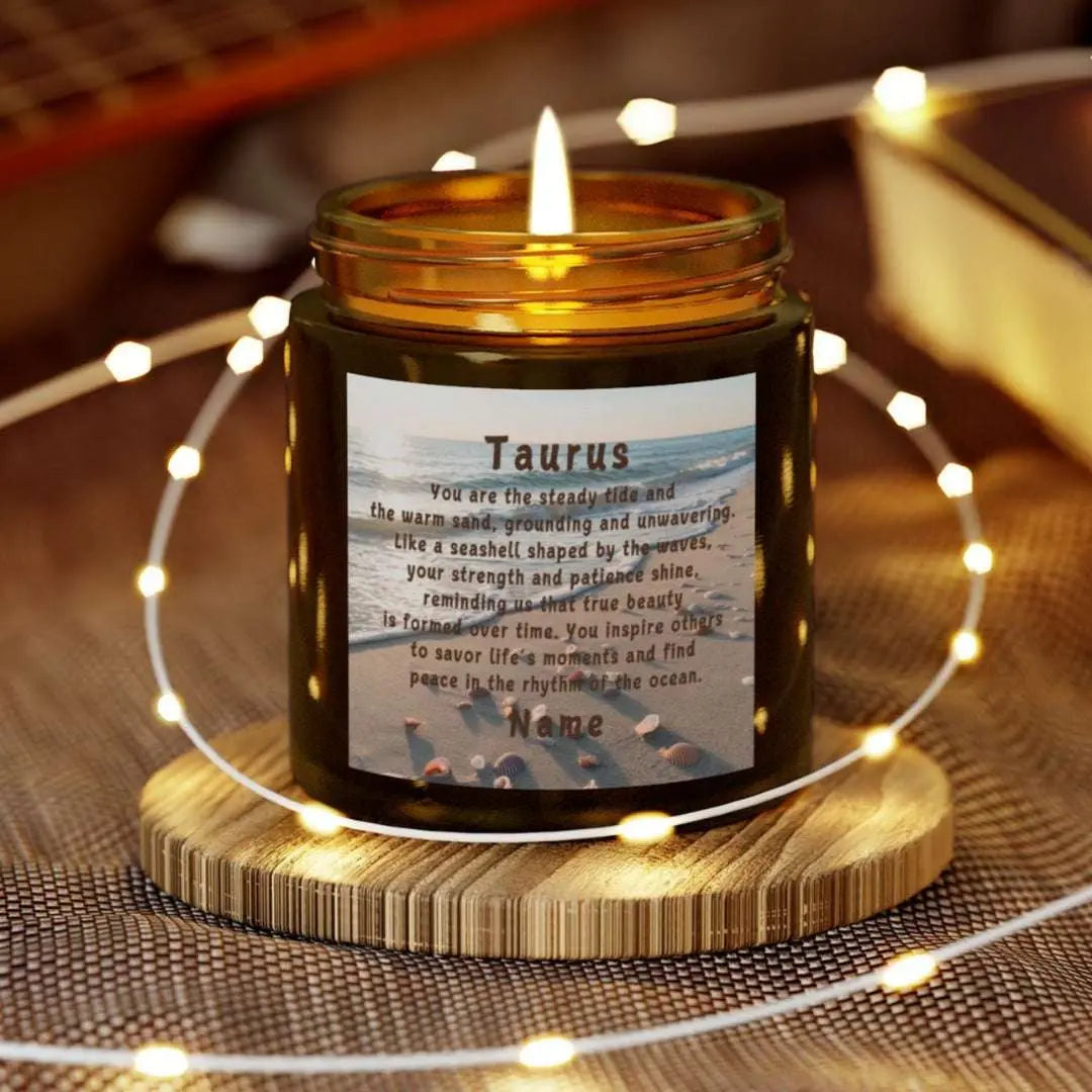 Elegant Taurus Zodiac hand-poured coconut apricot wax scented candle in a 4 oz amber glass jar, featuring a scene of the beach with seashells and an inspirational quote personalized. A beach-inspired astrology gift, perfect for relaxation and decor.