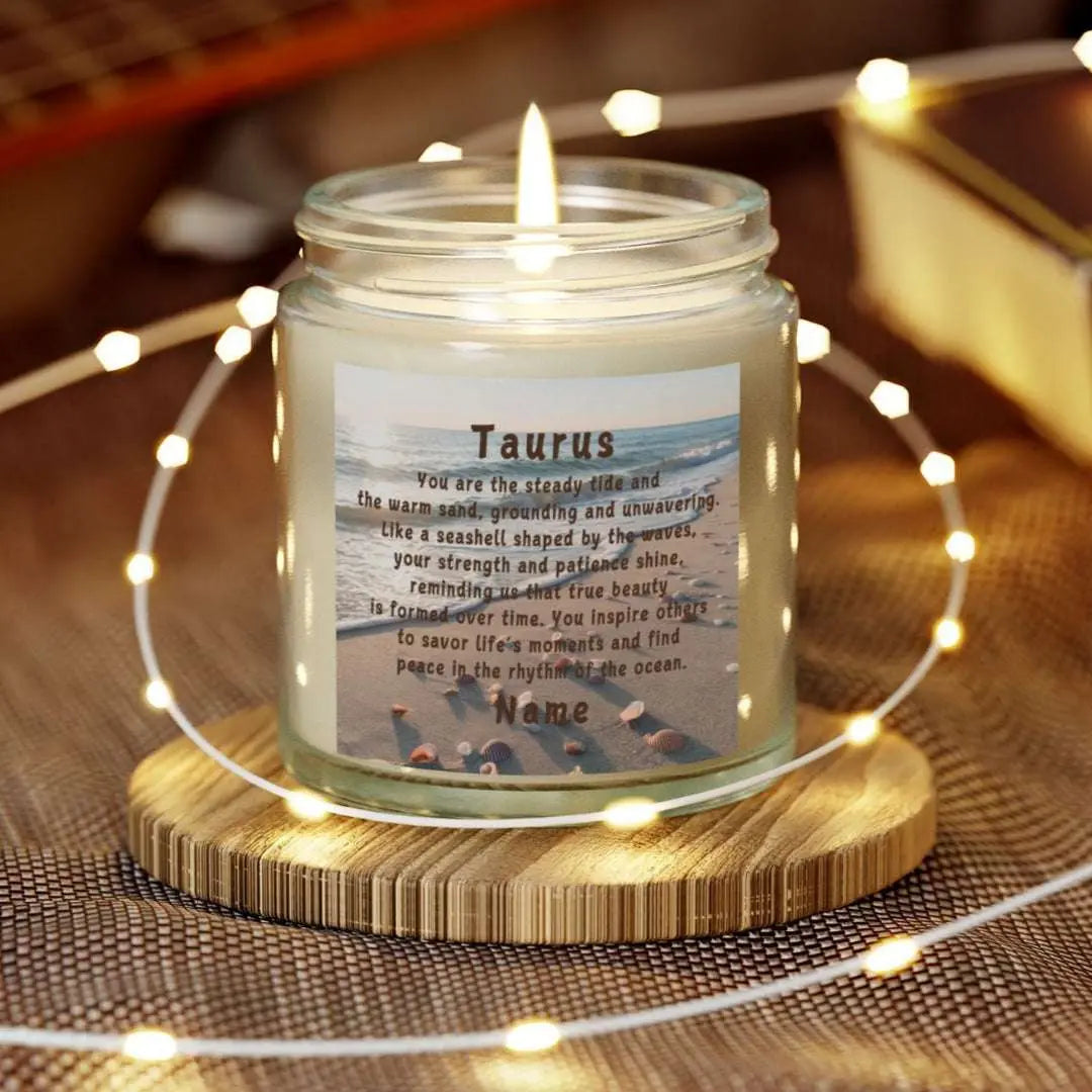 Elegant Taurus Zodiac hand-poured coconut apricot wax scented candle in a 4 oz clear glass jar, featuring a scene of the beach with seashells and an inspirational quote personalized. A beach-inspired astrology gift, perfect for relaxation and decor.