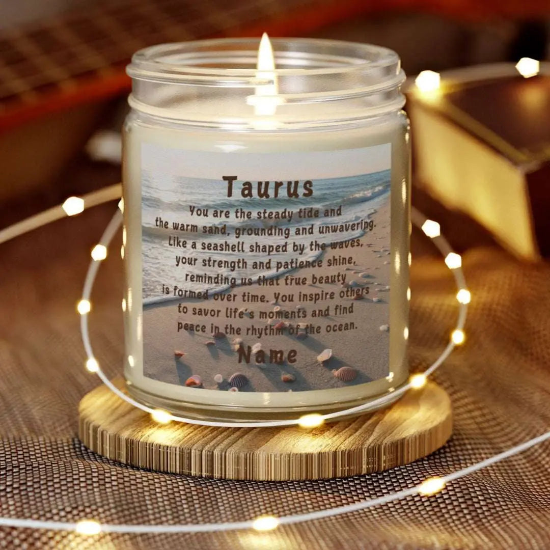 Elegant Taurus Zodiac hand-poured coconut apricot wax scented candle in a 9 oz clear glass jar, featuring a scene of the beach with seashells and an inspirational quote personalized. A beach-inspired astrology gift, perfect for relaxation and decor.
