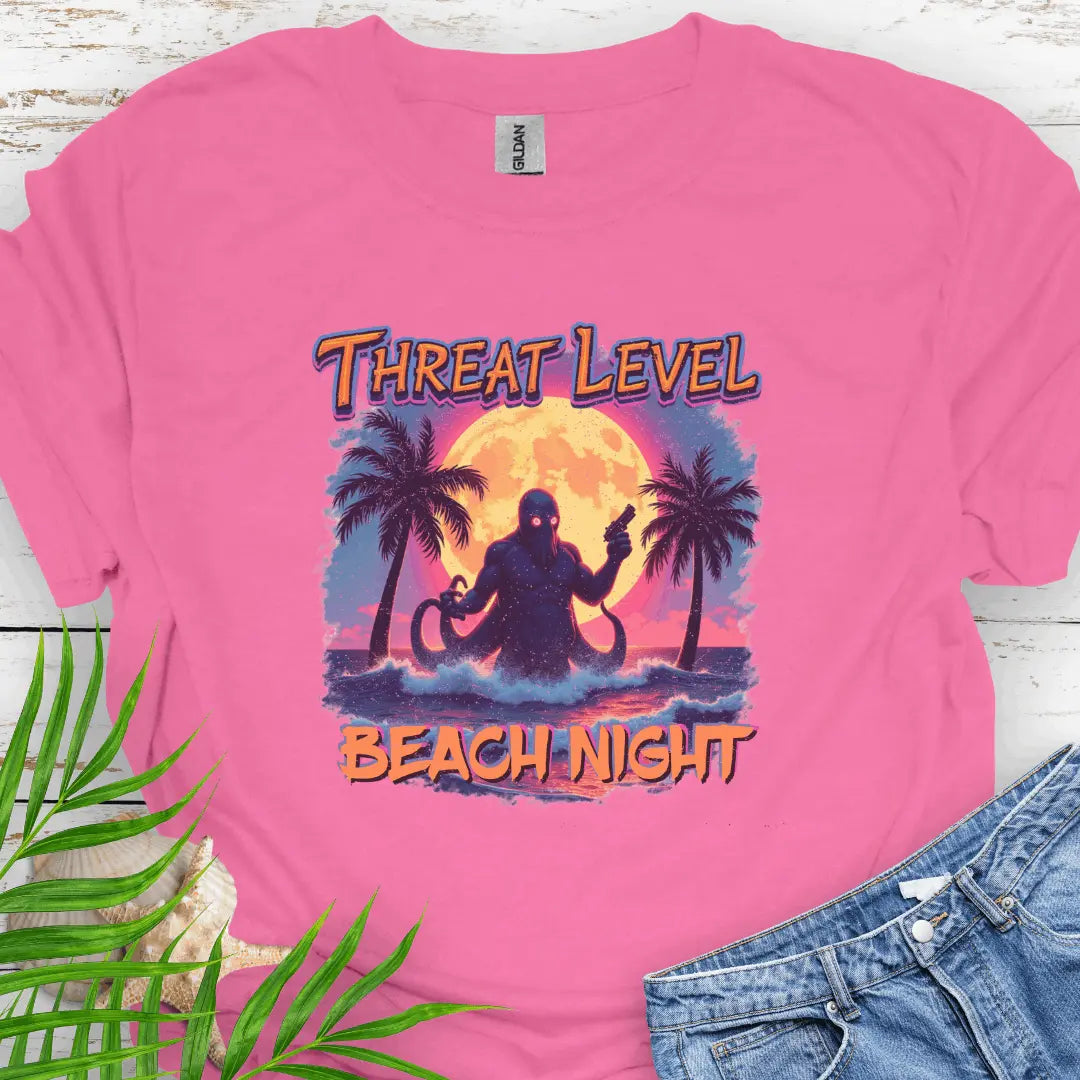 Azalea T-shirt with the words Threat Level Beach Night and an octopus villain coming out of the ocean with a bright moon background in a retro 80's movie poster vibe.