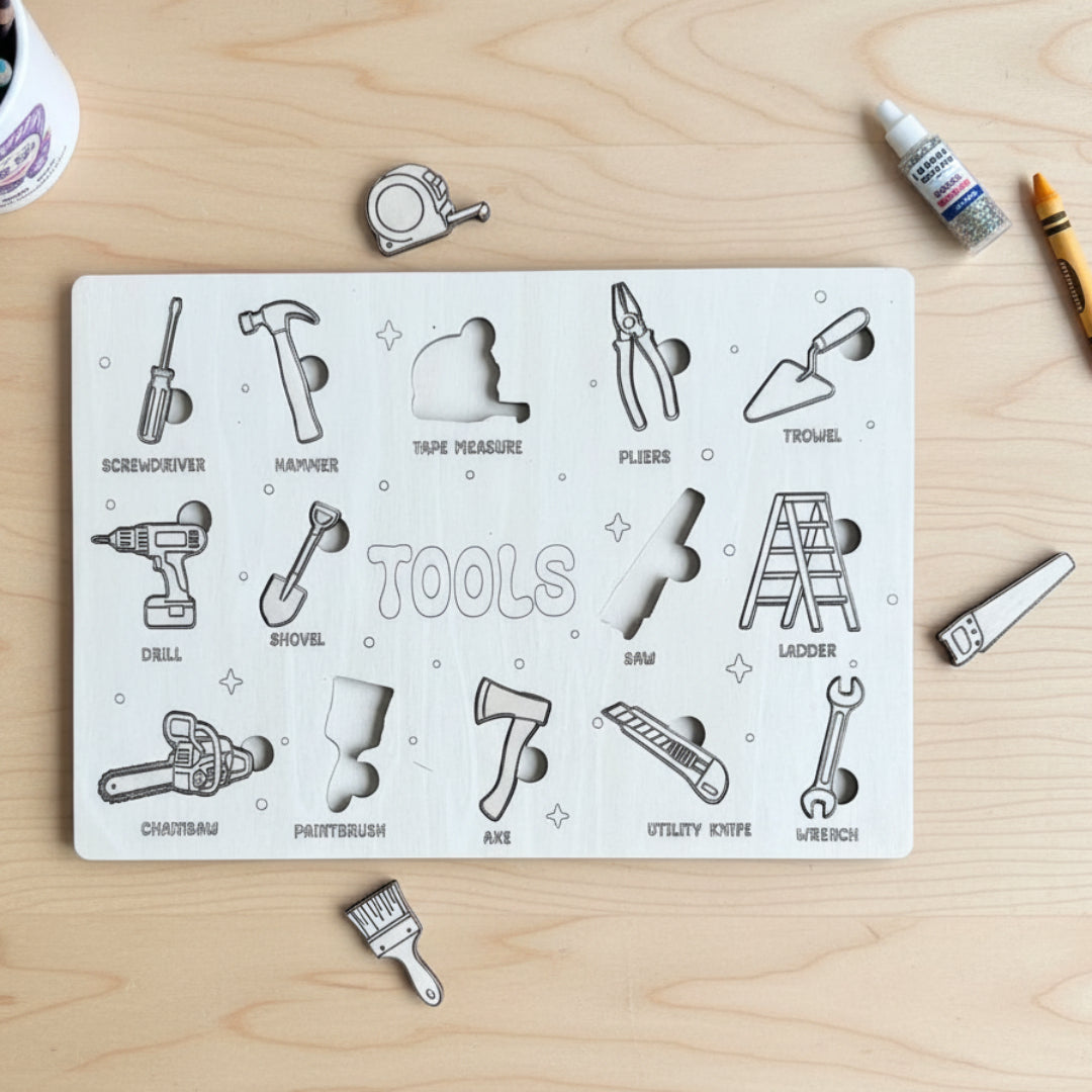 A wooden puzzle board with engraved tool shapes, including screwdriver, hammer, tape measure, pliers, trowel, drill, shovel, saw, ladder, chainsaw, paintbrush, axe, utility knife, and wrench, with several loose puzzle pieces placed nearby.