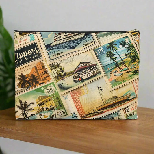 Our Vintage Traveler Accessory Pouch constructed from a durable material with a zipper closure featuring an array of vintage stamps. Available in small or large.