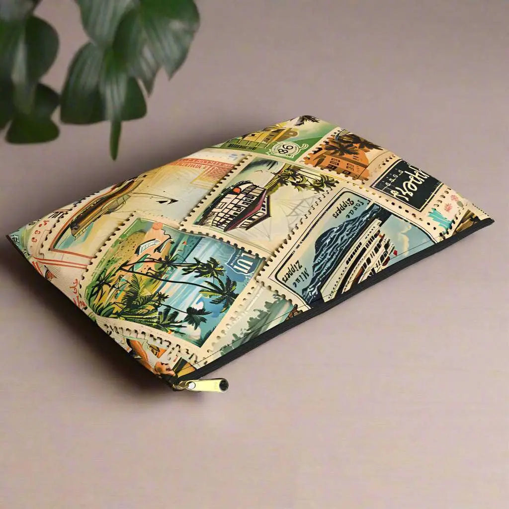 Our Vintage Traveler Accessory Pouch constructed from a durable material with a zipper closure featuring an array of vintage stamps. Available in small or large.