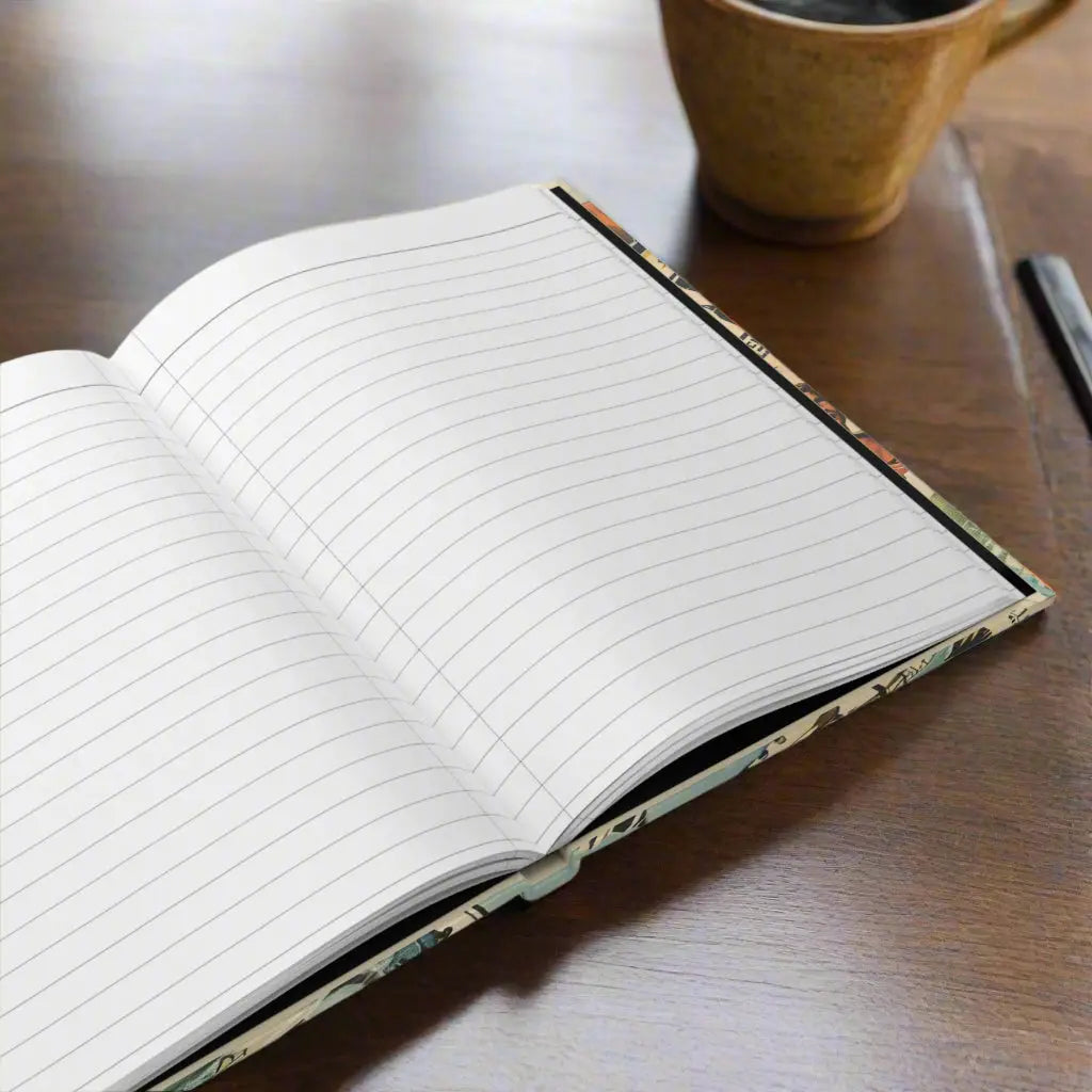 Open hardcover journal with white lined perforated pages.