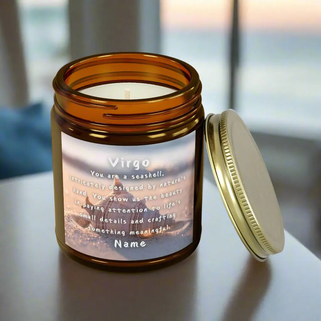 Elegant Virgo Zodiac hand-poured coconut apricot wax scented candle in a 9 oz amber glass jar with gold lid, featuring a Seashell in the sand with waves coming in and an inspirational quote personalized. A beach-inspired astrology gift, perfect for relaxation and decor.