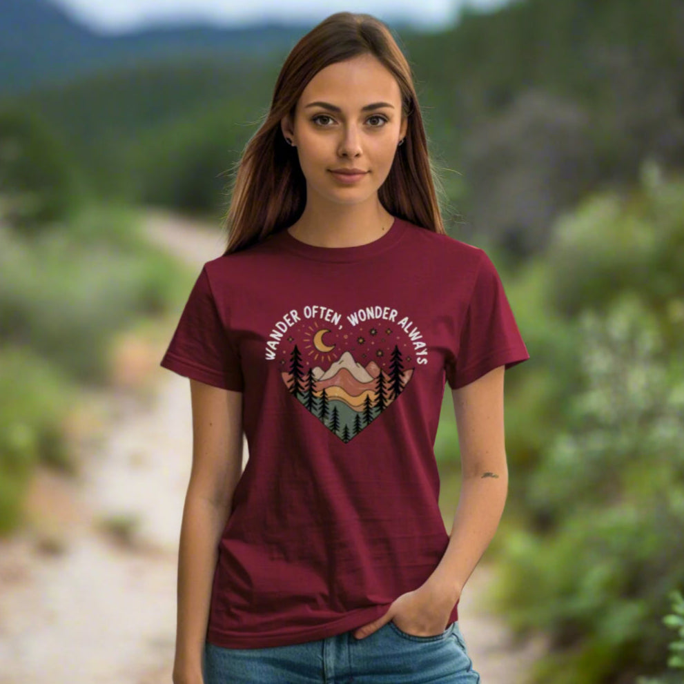 Maroon Unisex t-shirt with mountain and trees in a heart shape and the phrase "Wander Often, Wonder Always".