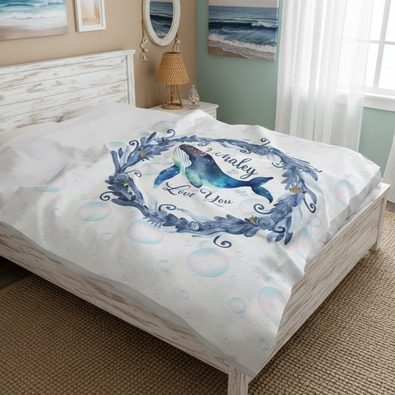 White Velveteen Plush blanket with blue marine plant wreath with swimming whale in the middle and text I Whaley Love You -perfect for snuggling up with your beachy loved ones!