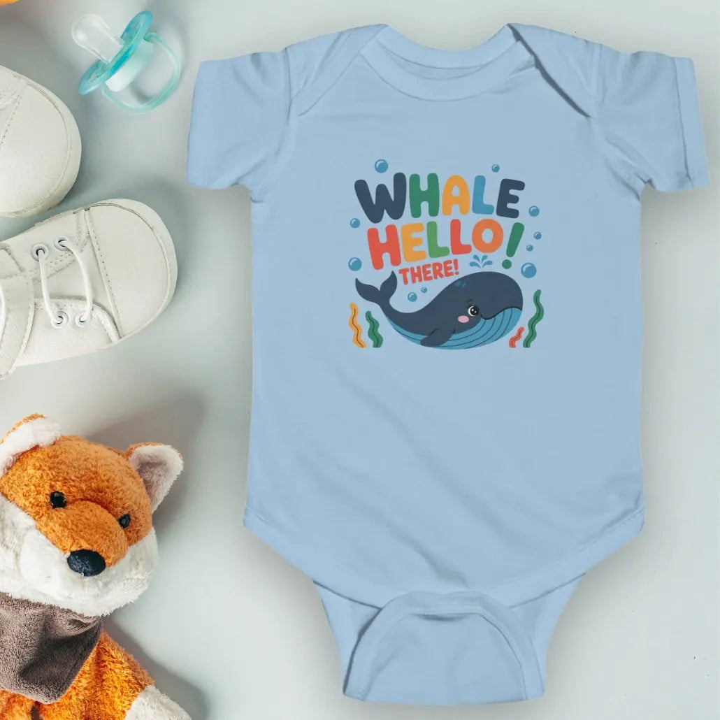 Whale Hello Child's Light Blue baby short-sleeved bodysuit with a fun whale swimming under the text with water bubbles and seaweed.