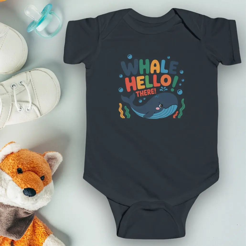 Whale Hello Child's Navy baby short-sleeved bodysuit with a fun whale swimming under the text with water bubbles and seaweed.