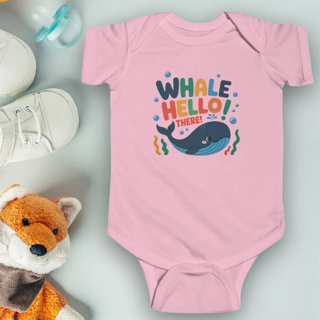 Whale Hello Child's Pink baby short-sleeved bodysuit with a fun whale swimming under the text with water bubbles and seaweed.