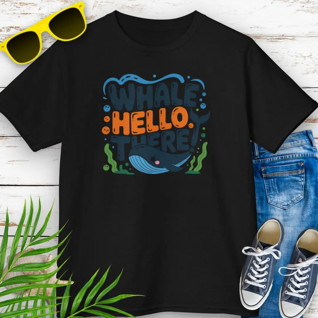 Whale Hello Child's Black T-Shirt with a fun whale swimming under the text with water bubbles and seaweed.