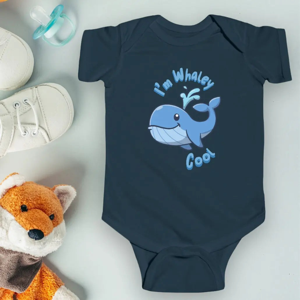 Navy infant one-piece bodysuit with a cartoon whale that says I'm Whaley Cool.